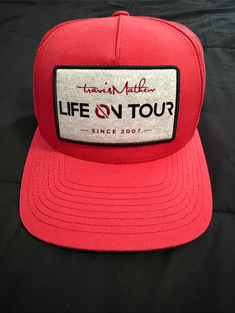 Travis Mathew Red "Life On Tour" Patch Trucker Hat
